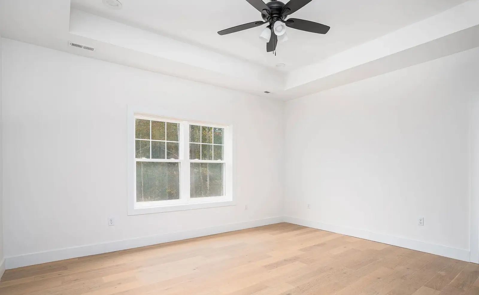 new construction bedroom with hardwood floors modern farmhouse