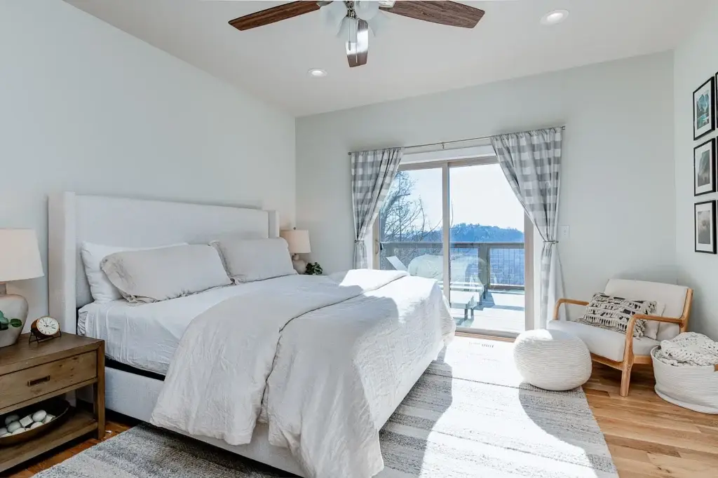 bedroom with large windows in Asheville mountain home