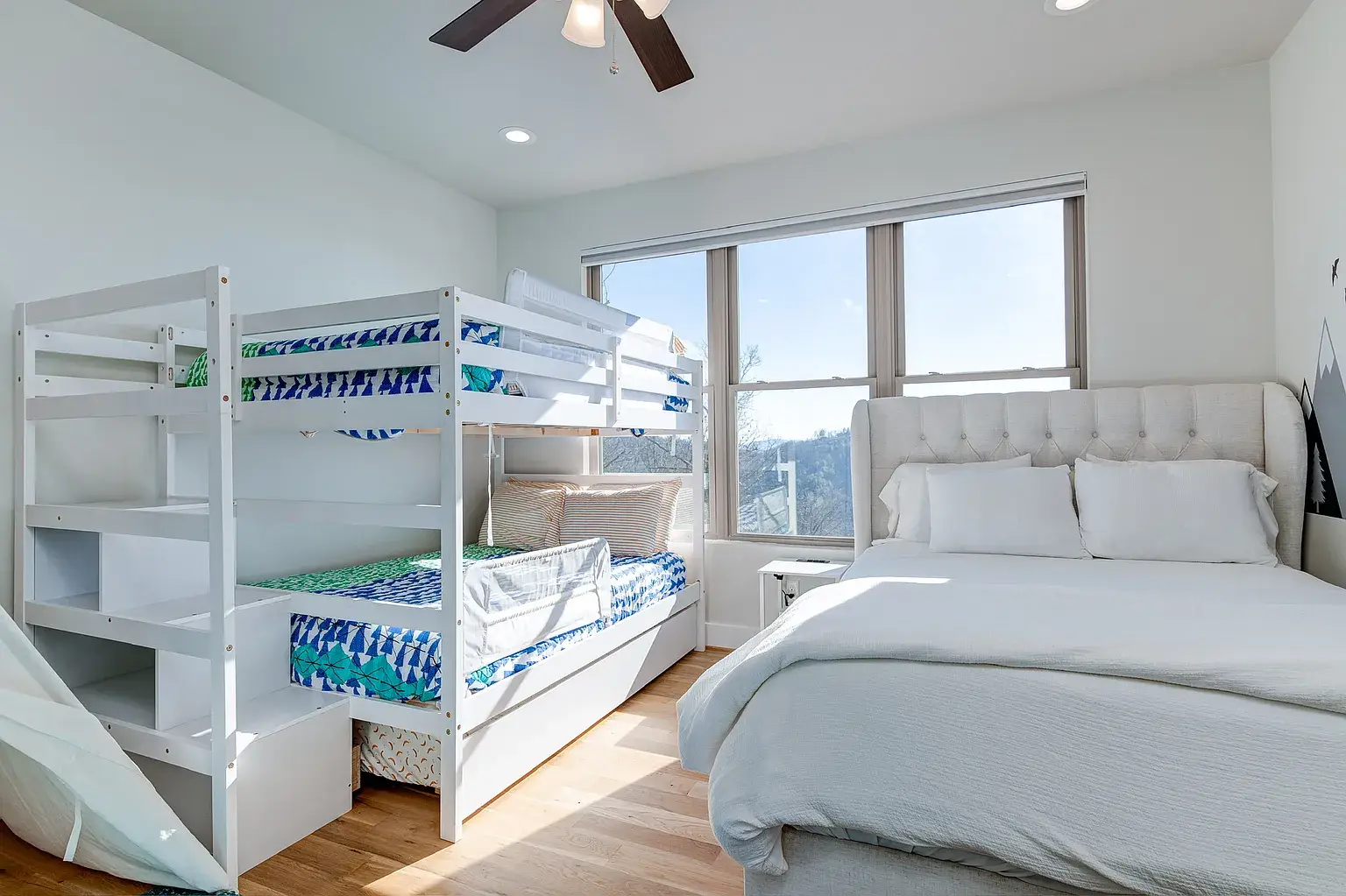 bedroom with large windows in Asheville mountain home