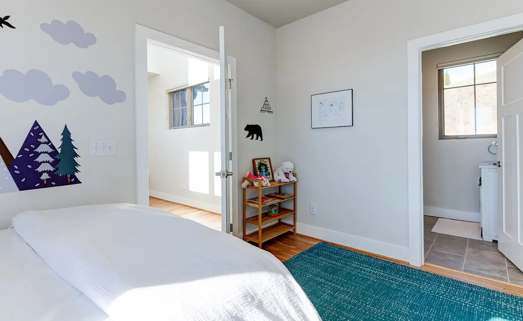 bedroom with large windows in Asheville mountain home