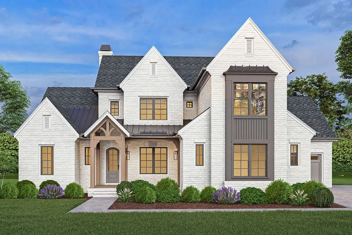 Modern transitional home with white brick siding and decorative gables