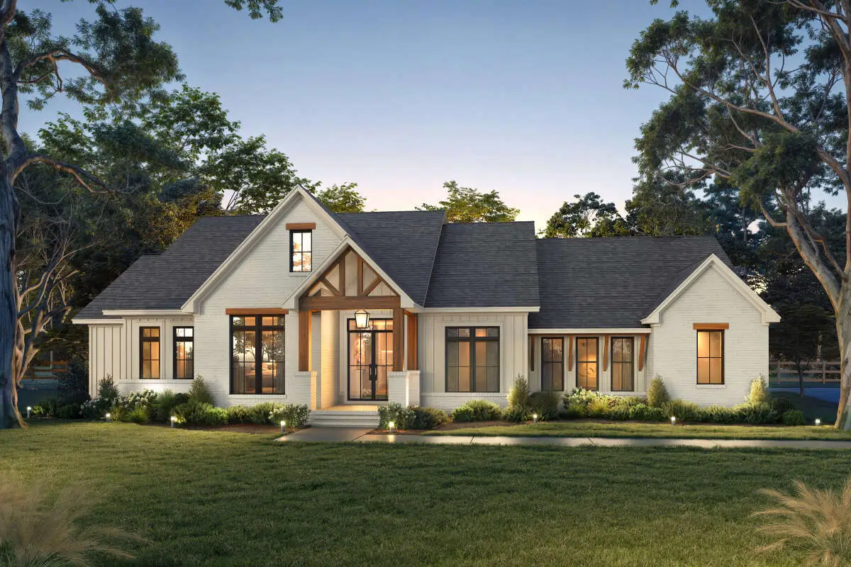 Modern farmhouse home with cedar trim, stucco and board and batten siding, and large windows throughout
