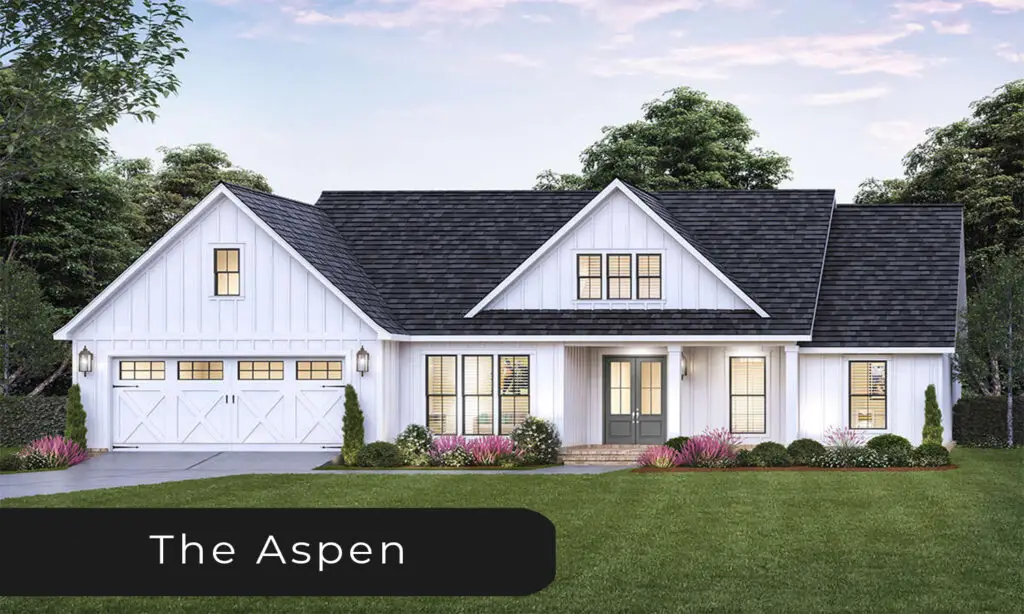 Modern white farmhouse with black trim and attached two-car garage